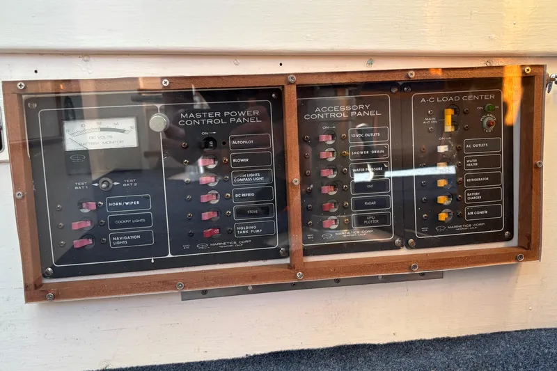 Slide: The Image of Control panels on a 1985 Jarvis Newman 36 boat, featuring power and accessory switches. - 40