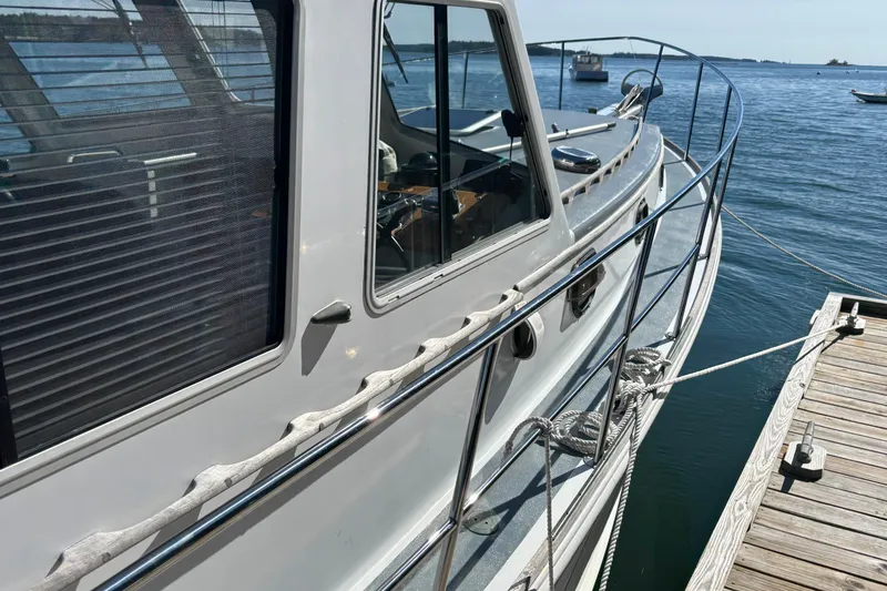 Slide: The Image of 1985 Jarvis Newman 36 boat docked, showcasing sleek design and nautical features. - 42