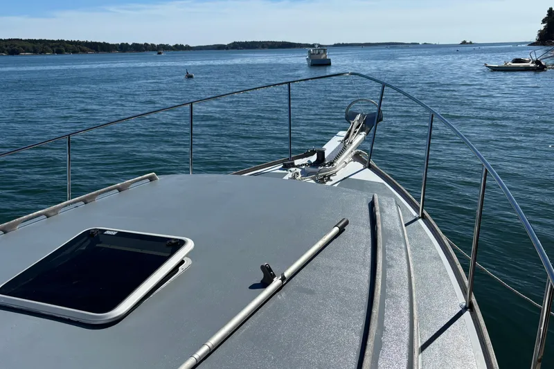 Slide: The Image of 1985 Jarvis Newman 36 boat deck overlooking calm waters and distant shoreline. - 43