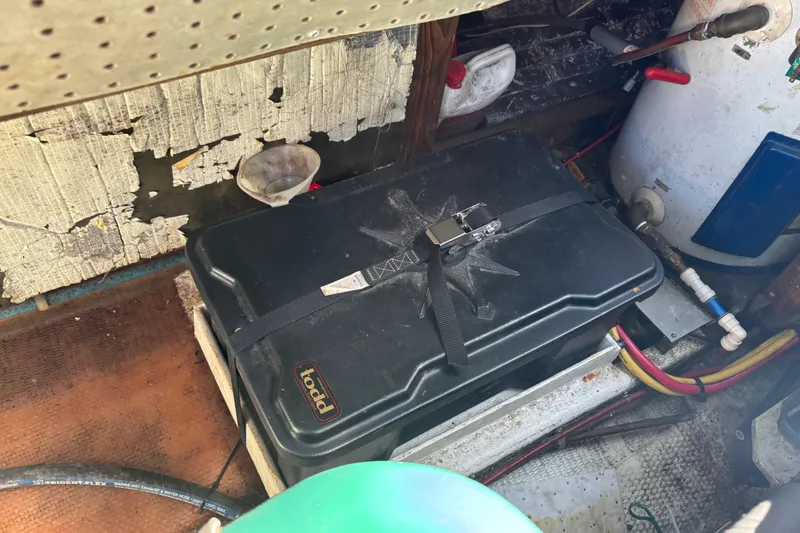 Slide: The Image of Battery compartment in 1985 Jarvis Newman 36 boat, showing wiring and equipment. - 50