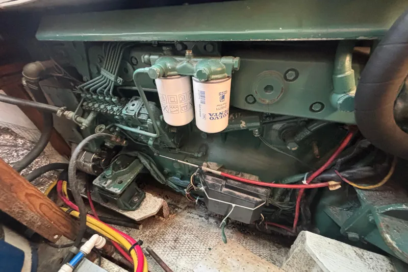 Slide: The Image of Engine compartment of a 1985 Jarvis Newman 36 boat, featuring Volvo Penta components. - 51