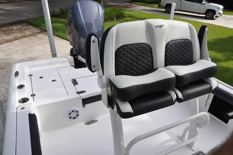 Slide: The Image of 2024 Tidewater 2300 Carolina Bay boat with dual cushioned seats and sleek design. - 20