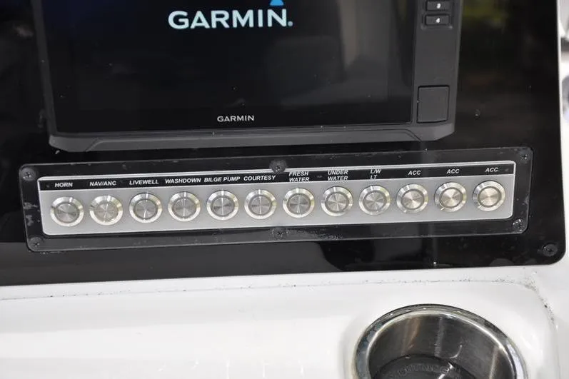 Slide: The Image of Control panel of 2024 Tidewater 2300 Carolina Bay boat with Garmin display. - 22