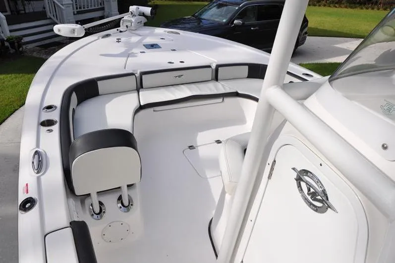 Slide: The Image of 2024 Tidewater 2300 Carolina Bay boat interior with seating and console. - 28