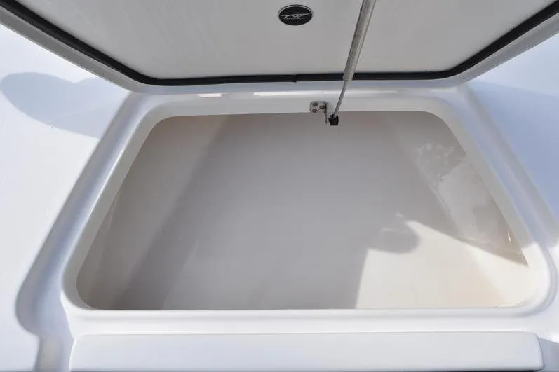 Slide: The Image of Open storage compartment on 2024 Tidewater 2300 Carolina Bay boat. - 35