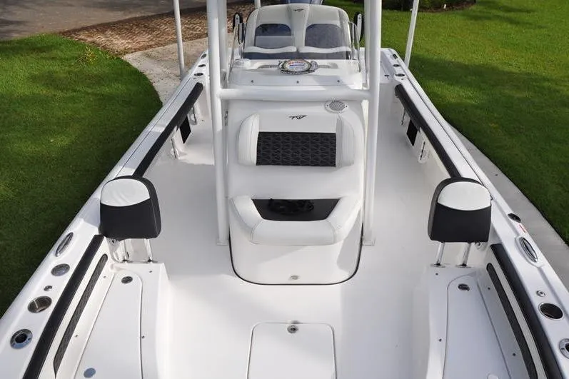 Slide: The Image of 2024 Tidewater 2300 Carolina Bay boat interior with seating and console. - 37