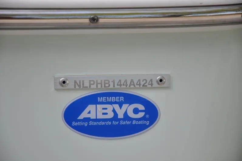 Slide: The Image of 2024 Tidewater 2300 Carolina Bay boat with ABYC membership plaque and serial number. - 39