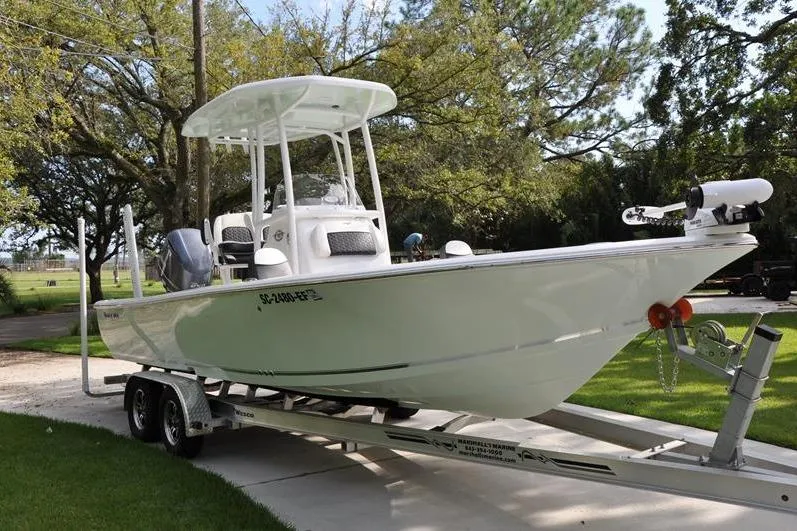 Slide: The Image of 2024 Tidewater 2300 Carolina Bay boat on trailer, parked outdoors. - 6