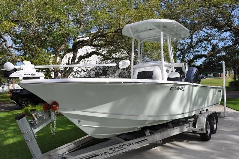 Slide: The Image of 2024 Tidewater 2300 Carolina Bay boat on trailer, parked outdoors. - 8