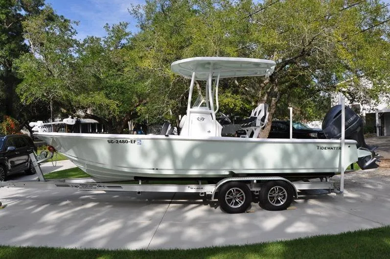 Slide: The Image of 2024 Tidewater 2300 Carolina Bay boat on trailer, parked outdoors. - 9