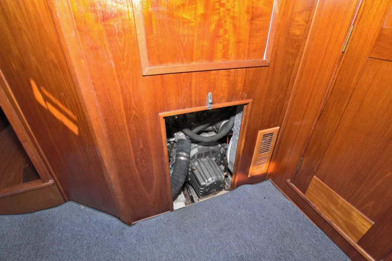 Slide: The Image of Engine compartment of 1987 Morgan 43 CC sailboat with wooden interior paneling. - 61