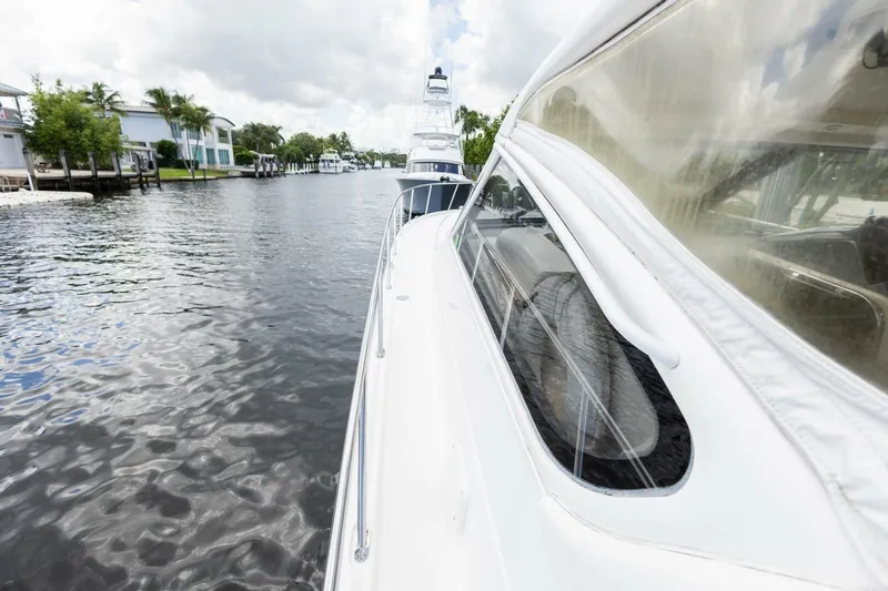 Slide: The Image of 2000 Tiara Yachts 5200 Express cruising on a scenic waterway. - 22