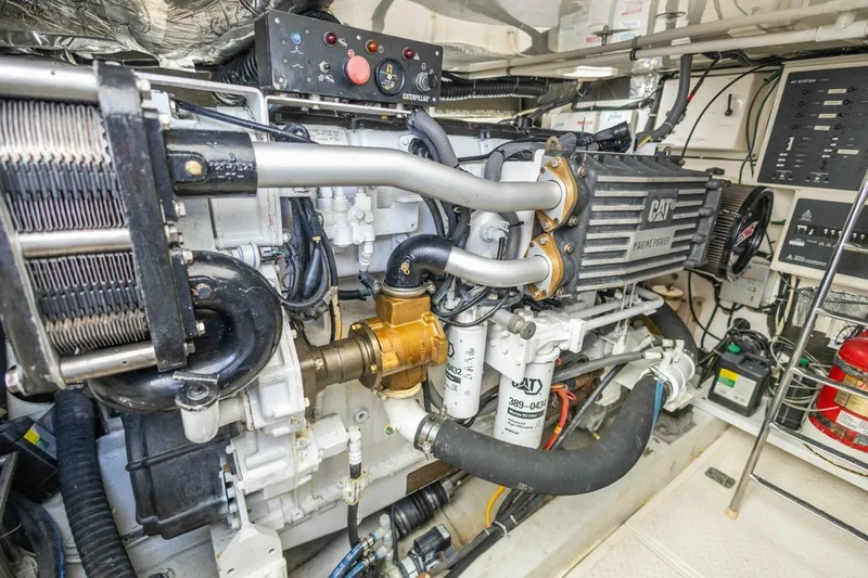 Slide: The Image of Engine room of 2000 Tiara Yachts 5200 Express, featuring CAT marine power system. - 30
