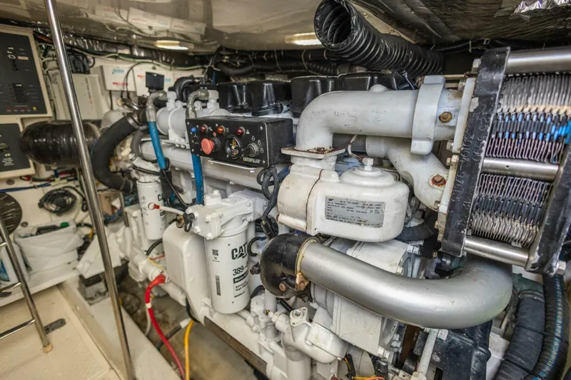 Slide: The Image of Engine room of 2000 Tiara Yachts 5200 Express, featuring Caterpillar machinery. - 31