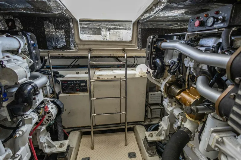 Slide: The Image of Engine room of 2000 Tiara Yachts 5200 Express, showcasing machinery and equipment. - 32