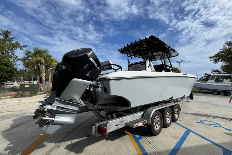Slide: The Image of 2026 Fountain 34 Tournament Edition boat on trailer, featuring powerful Mercury outboard engines. - 10