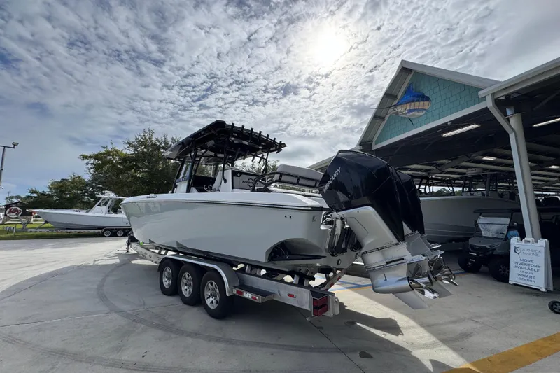 Slide: The Image of 2026 Fountain 34 Tournament Edition boat on trailer under cloudy sky. - 13