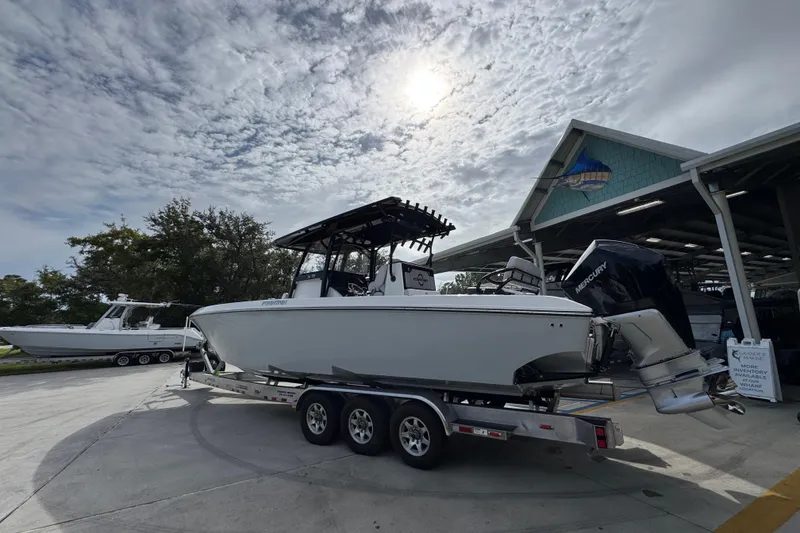 Slide: The Image of 2026 Fountain 34 Tournament Edition boat on trailer under cloudy sky. - 14