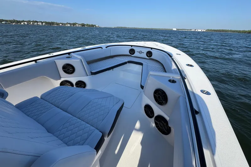 Slide: The Image of 2026 Fountain 34 Tournament Edition boat interior with luxurious seating and speakers on open water. - 15