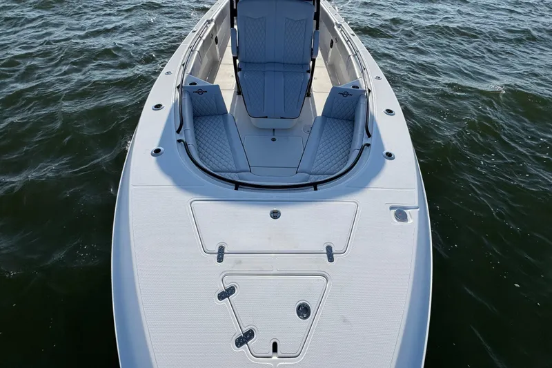 Slide: The Image of 2026 Fountain 34 Tournament Edition boat on water, featuring sleek design and seating. - 18