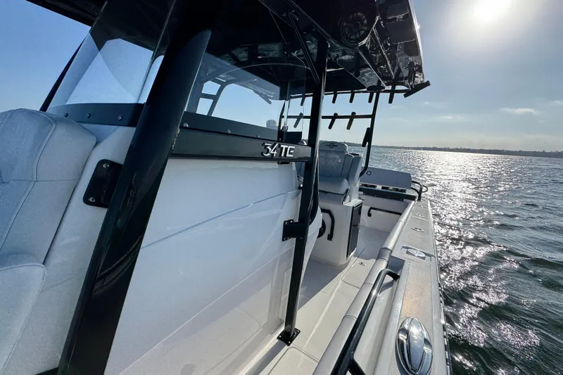 Slide: The Image of 2026 Fountain 34 Tournament Edition boat on water, sunlit and sleek design. - 21