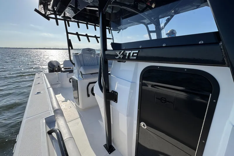Slide: The Image of 2026 Fountain 34 Tournament Edition boat on water, showcasing sleek design and seating. - 22