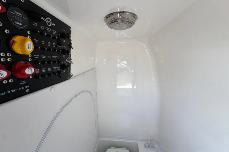 Slide: The Image of 2026 Fountain 34 Tournament Edition boat interior with control panel and lighting. - 25