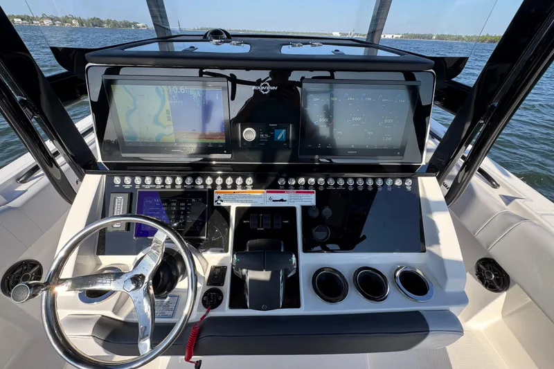 Slide: The Image of Helm of 2026 Fountain 34 Tournament Edition boat with advanced navigation displays. - 27