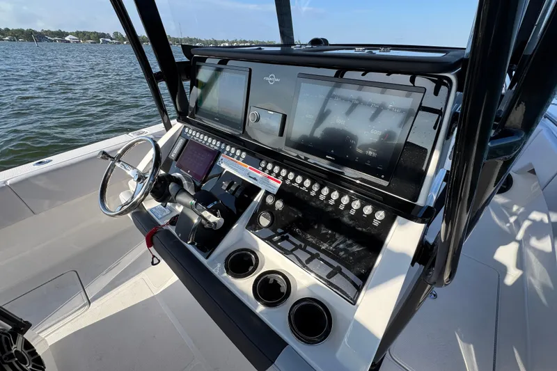 Slide: The Image of Helm of 2026 Fountain 34 Tournament Edition boat with advanced navigation controls. - 29