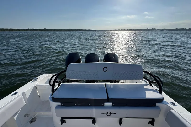 Slide: The Image of 2026 Fountain 34 Tournament Edition boat on open water, rear view with engines. - 36