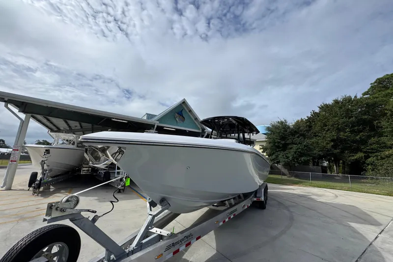 Slide: The Image of 2026 Fountain 34 Tournament Edition boat on trailer under cloudy sky. - 5