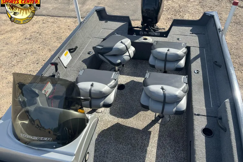Slide: The Image of 2014 Tracker Pro Guide V-16 SC boat interior with four seats and steering console. - 5