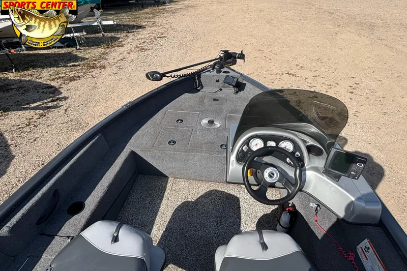 Slide: The Image of 2014 Tracker Pro Guide V-16 SC boat interior with steering console and seating. - 8