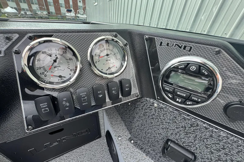 Slide: The Image of Dashboard of 2026 Lund 1800 Explorer Sport boat with gauges and controls. - 6