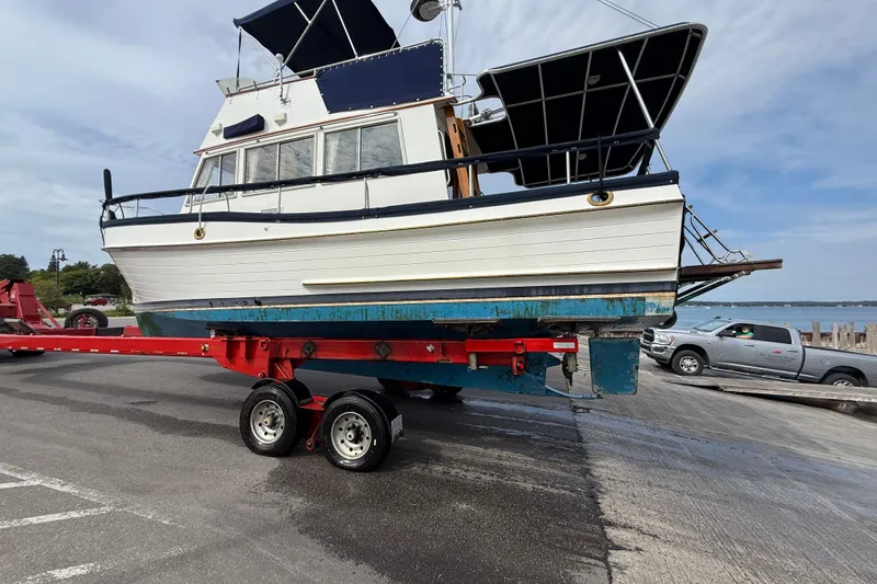 Slide: The Image of 1989 Grand Banks 32 Sedan on trailer at boat launch, ready for water. - 16