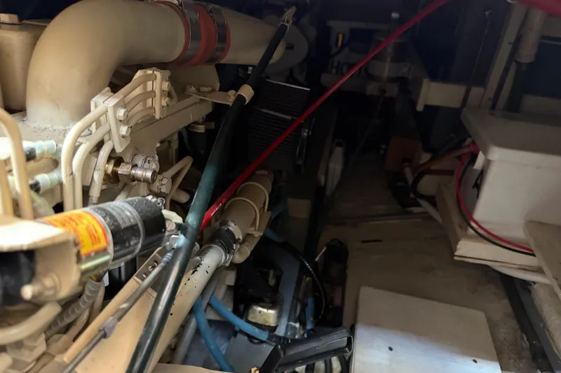 Slide: The Image of Engine room of a 1989 Grand Banks 32 Sedan with visible mechanical components. - 19