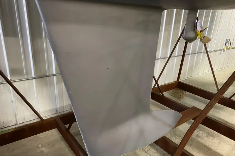 Slide: The Image of 2014 J Boats J/100 keel in storage, showcasing sleek design and craftsmanship. - 10