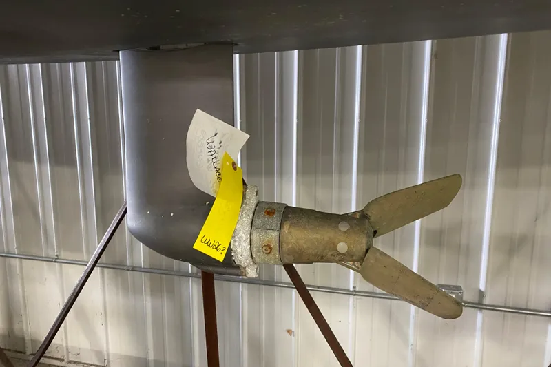 Slide: The Image of Propeller of 2014 J Boats J/100 sailboat in storage, with tags attached. - 11