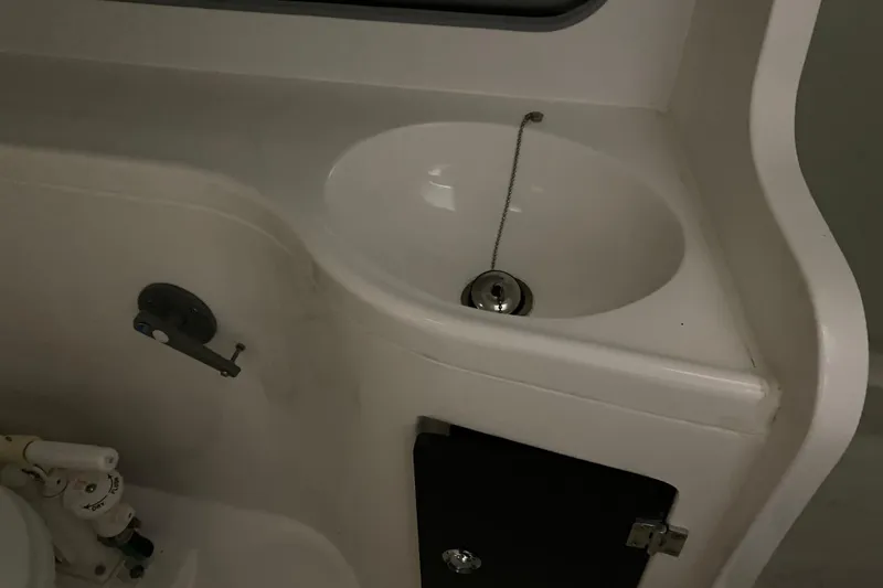 Slide: The Image of Compact sink area in a 2014 J Boats J/100 sailboat interior. - 36