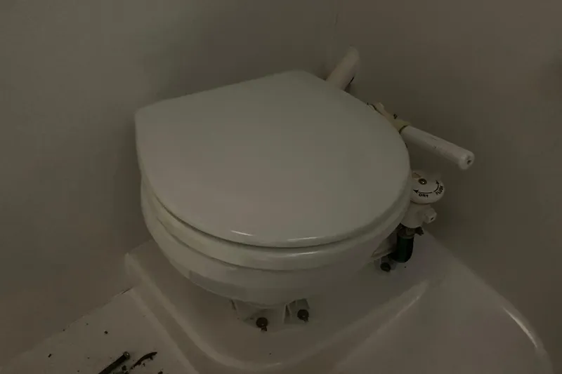 Slide: The Image of Marine toilet in a 2014 J Boats J/100 sailboat bathroom. - 37