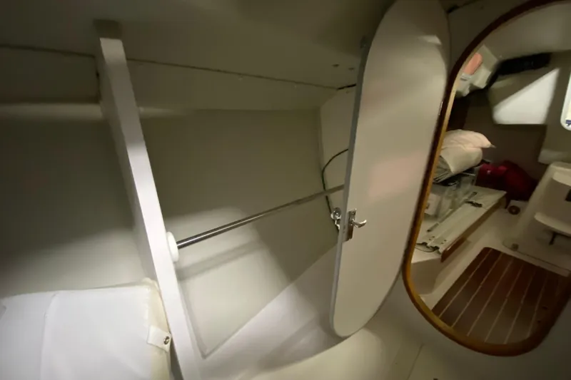 Slide: The Image of Interior of 2014 J Boats J/100 sailboat showing storage compartment and cabin area. - 38