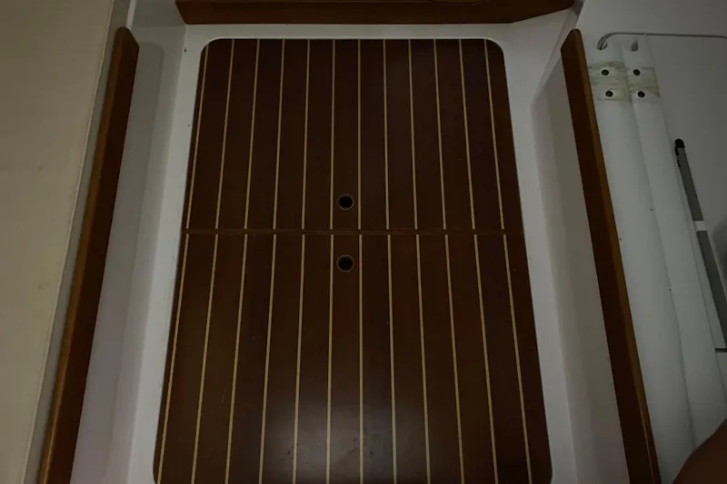Slide: The Image of 2014 J Boats J/100 interior with wooden flooring and white trim. - 44
