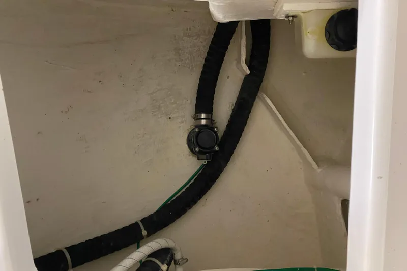 Slide: The Image of Interior view of 2014 J Boats J/100 sailboat showing plumbing and hoses. - 46