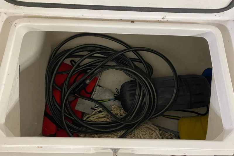 Slide: The Image of Storage compartment of a 2014 J Boats J/100 with ropes and equipment. - 47