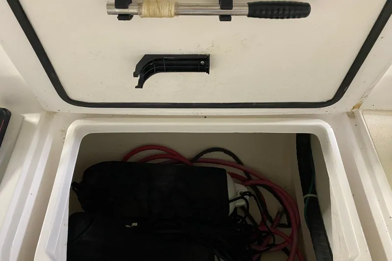 Slide: The Image of Storage compartment of a 2014 J Boats J/100 sailboat with ropes and equipment. - 48