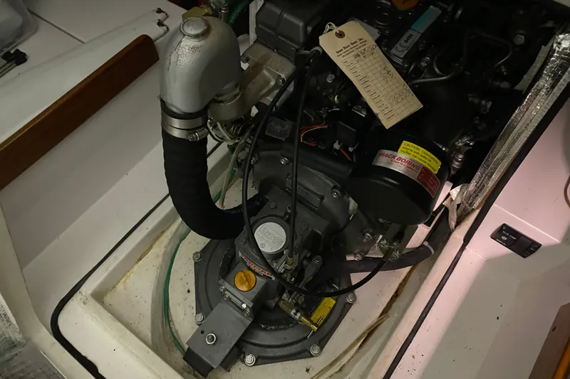Slide: The Image of Engine compartment of a 2014 J Boats J/100 sailboat, showing detailed mechanical components. - 50