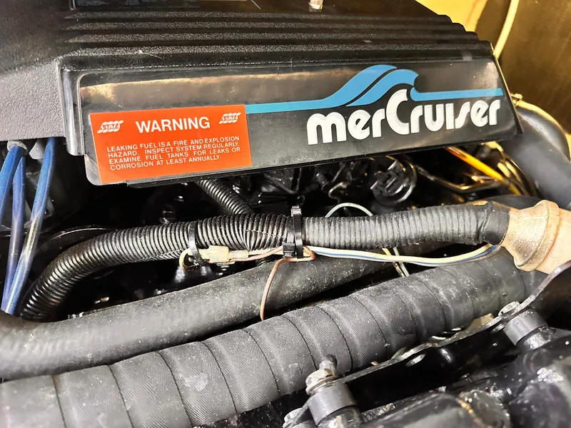 Slide: The Image of Engine of 1992 Sea Ray 400 Express Cruiser with MerCruiser branding and warning label. - 20