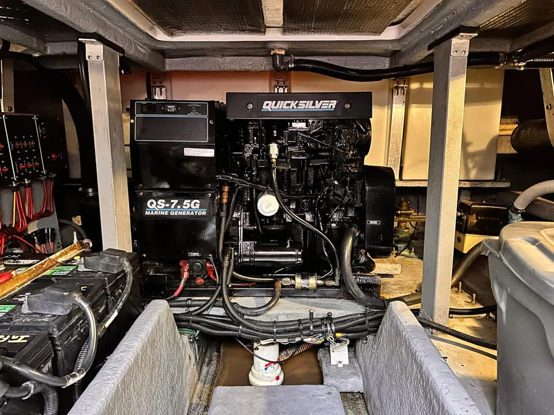 Slide: The Image of Engine room of 1992 Sea Ray 400 Express Cruiser with Quicksilver marine generator. - 21