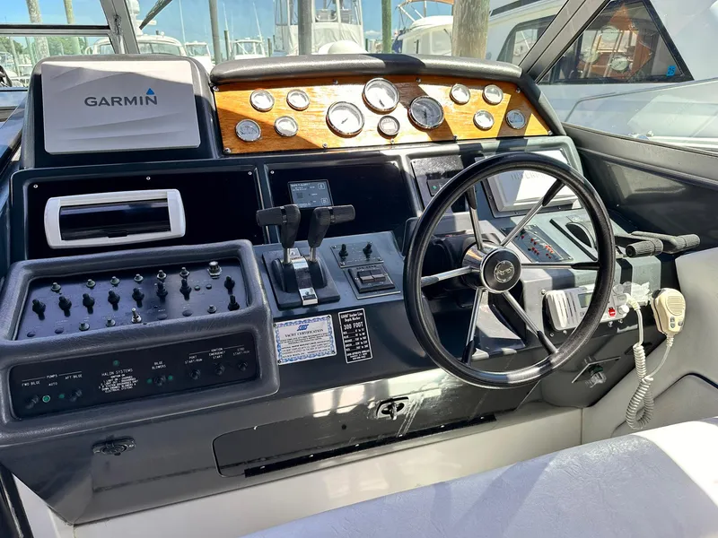 Slide: The Image of 1992 Sea Ray 400 Express Cruiser helm with Garmin navigation and control panel. - 7