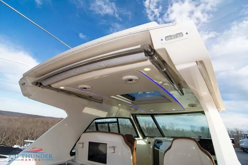 Slide: The Image of 2022 Scout 350 LXZ boat interior with modern design and panoramic views. - 12